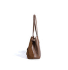 Brown leather handbag on a white background