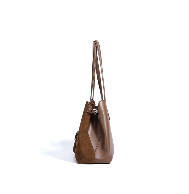 Brown leather handbag on a white background
