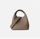 Brown handbag with a strap on a white background