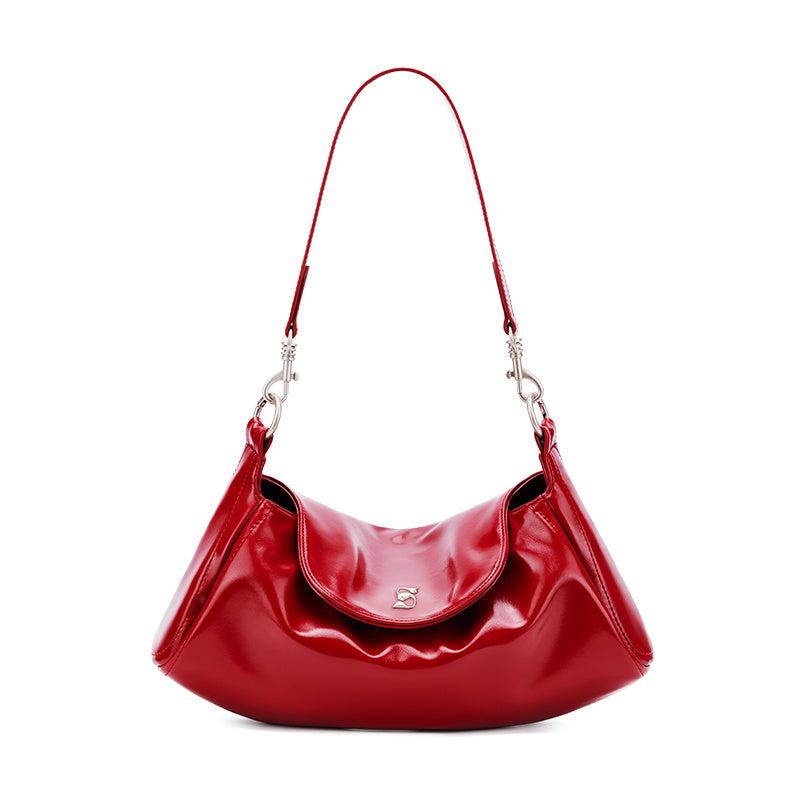 Red handbag with a silver clasp on a white background