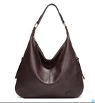 Brown leather handbag on a white background