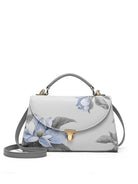 Floral-patterned handbag on a white background