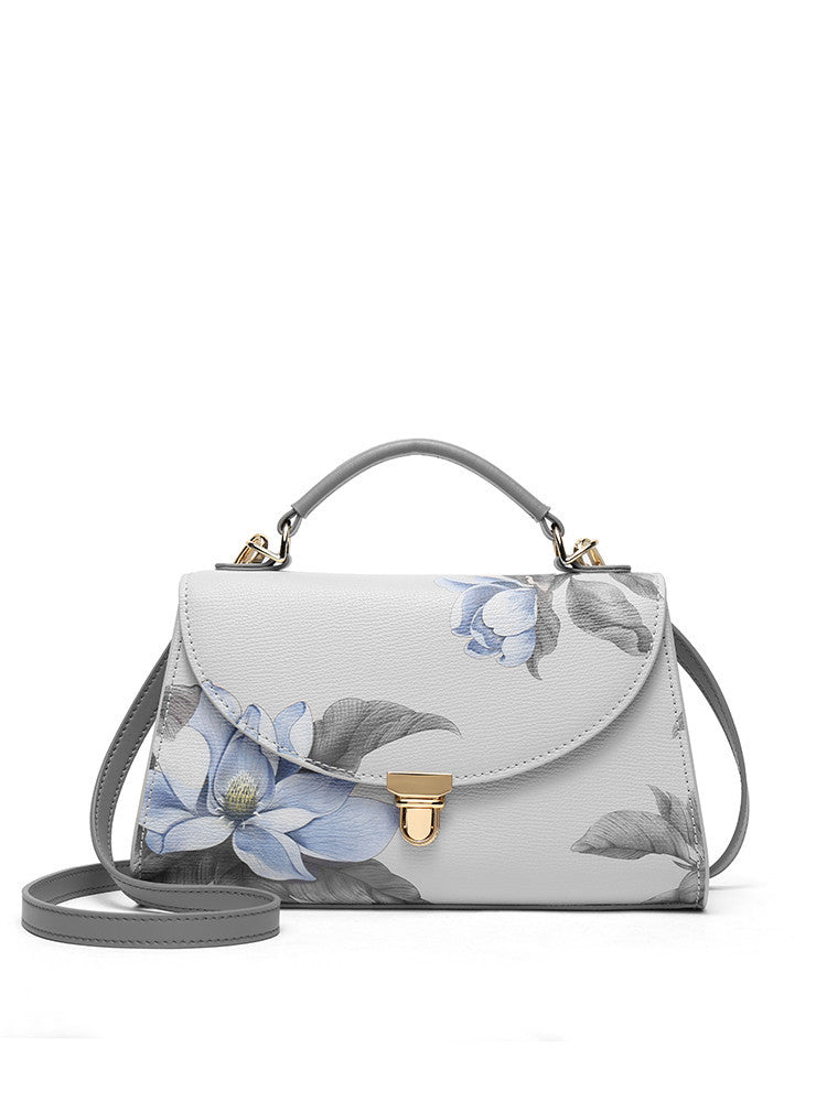 Floral-patterned handbag on a white background