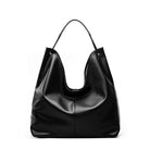 Black leather handbag on a white background