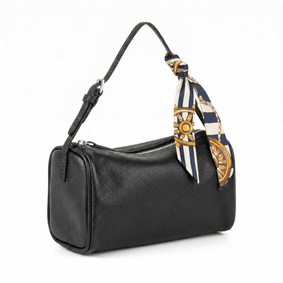A black pebbled leather shoulder bag with a top zipper, featuring a navy blue and cream silk scarf with gold nautical ship wheel patterns tied to the strap, shown on a white background.