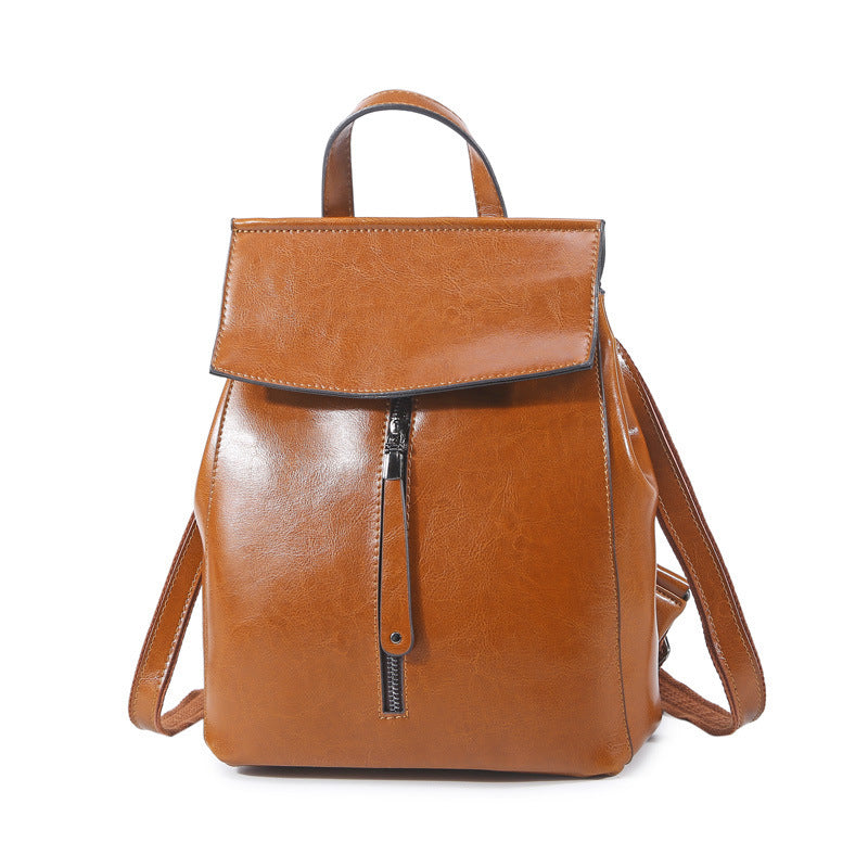 Brown leather backpack on a white background