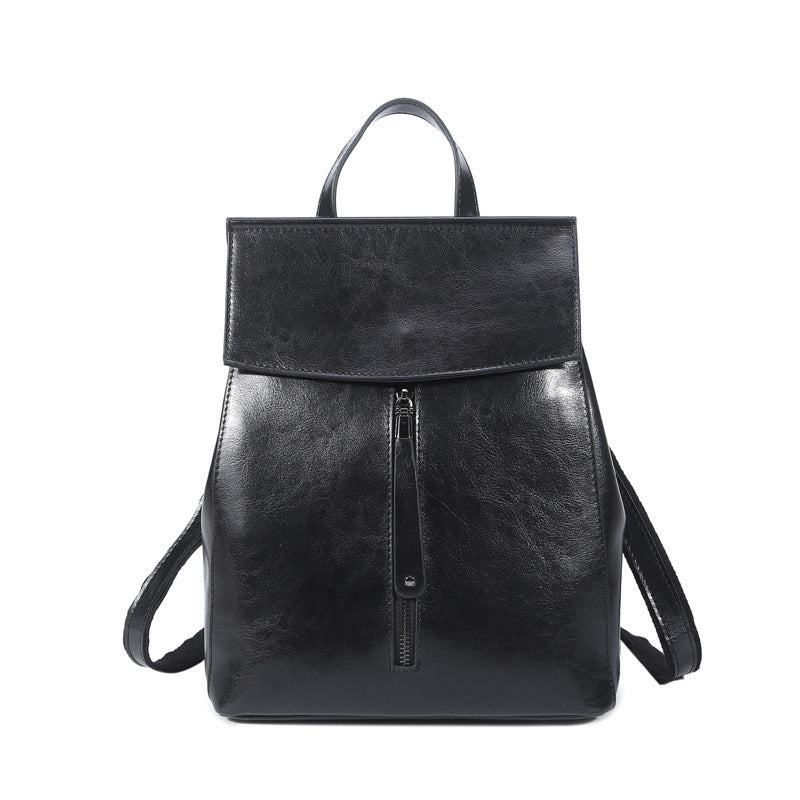 Black leather backpack on a white background