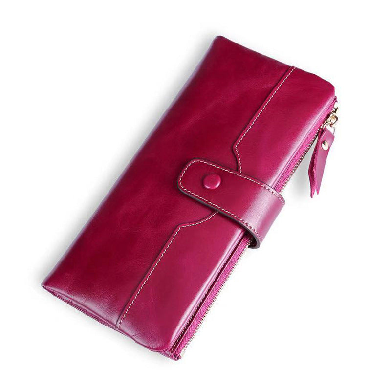Pink leather wallet on a white background
