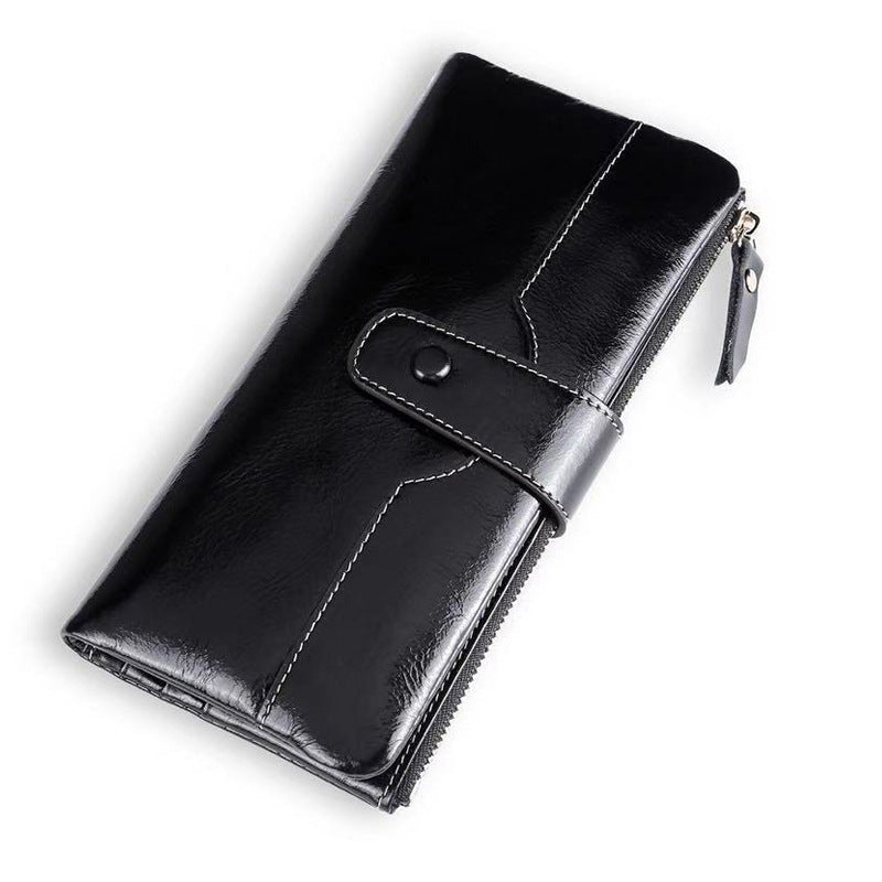 Black leather wallet with a zipper on a white background
