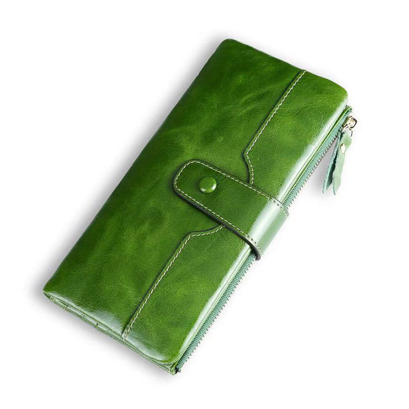 Green leather wallet on a white background