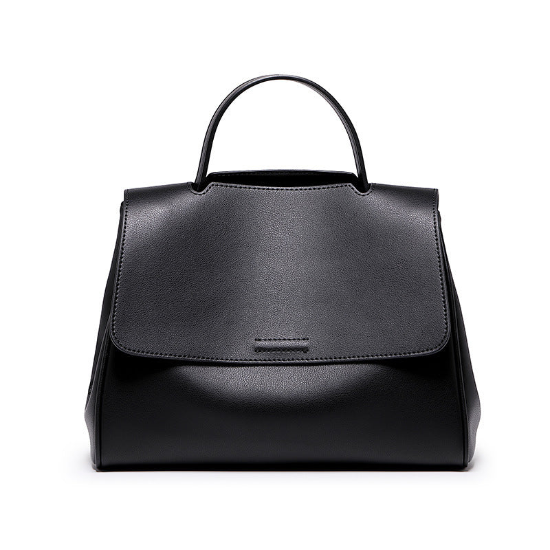 Black handbag on a white background