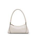 White handbag with gold accents on a white background