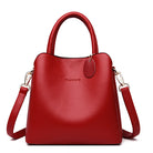 Red handbag with a visible brand logo on a white background