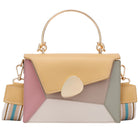 Multicolored handbag with a strap on a white background
