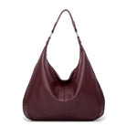 Maroon handbag on a white background