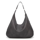 Black leather handbag on a white background