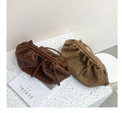 Two woven bags, one brown and one beige, on a white surface with a gray background.