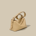 Beige handbag on a beige background