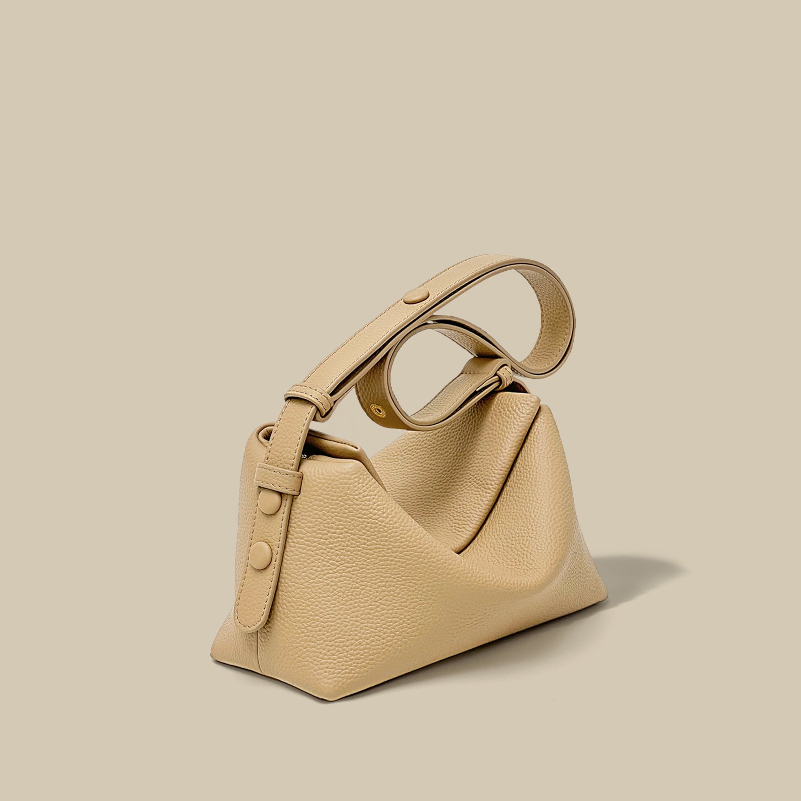 Beige handbag on a beige background