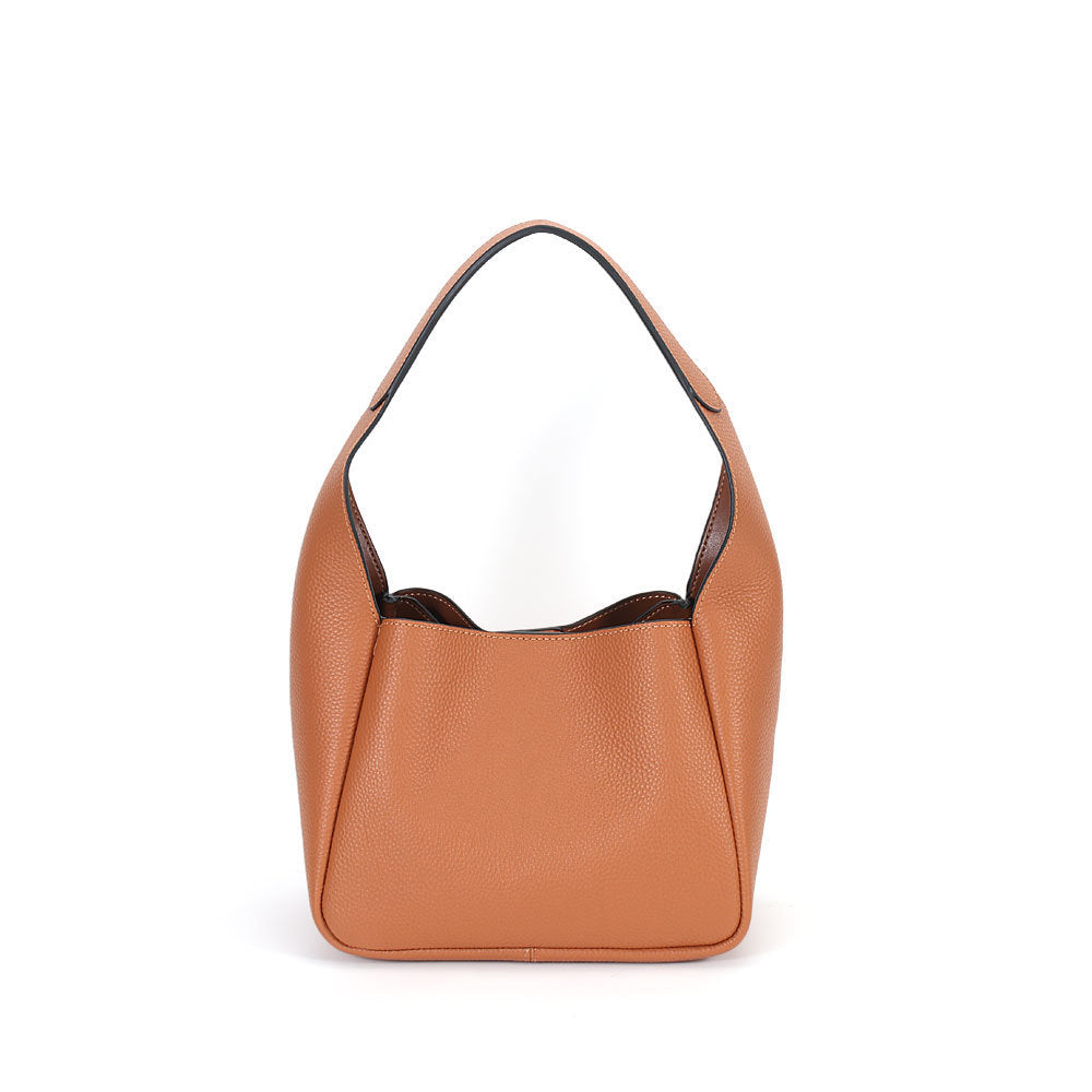Brown leather handbag on a white background