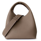 Brown leather handbag with a strap on a white background