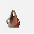 Two-toned handbag with beige and brown sections on a white background