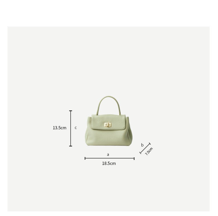 Green handbag with dimensions labeled on a white background