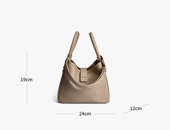 Beige handbag with measurements on a white background