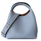 Light blue handbag with a strap on a white background