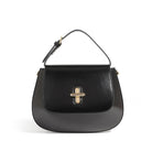 Black handbag with a gold clasp on a white background