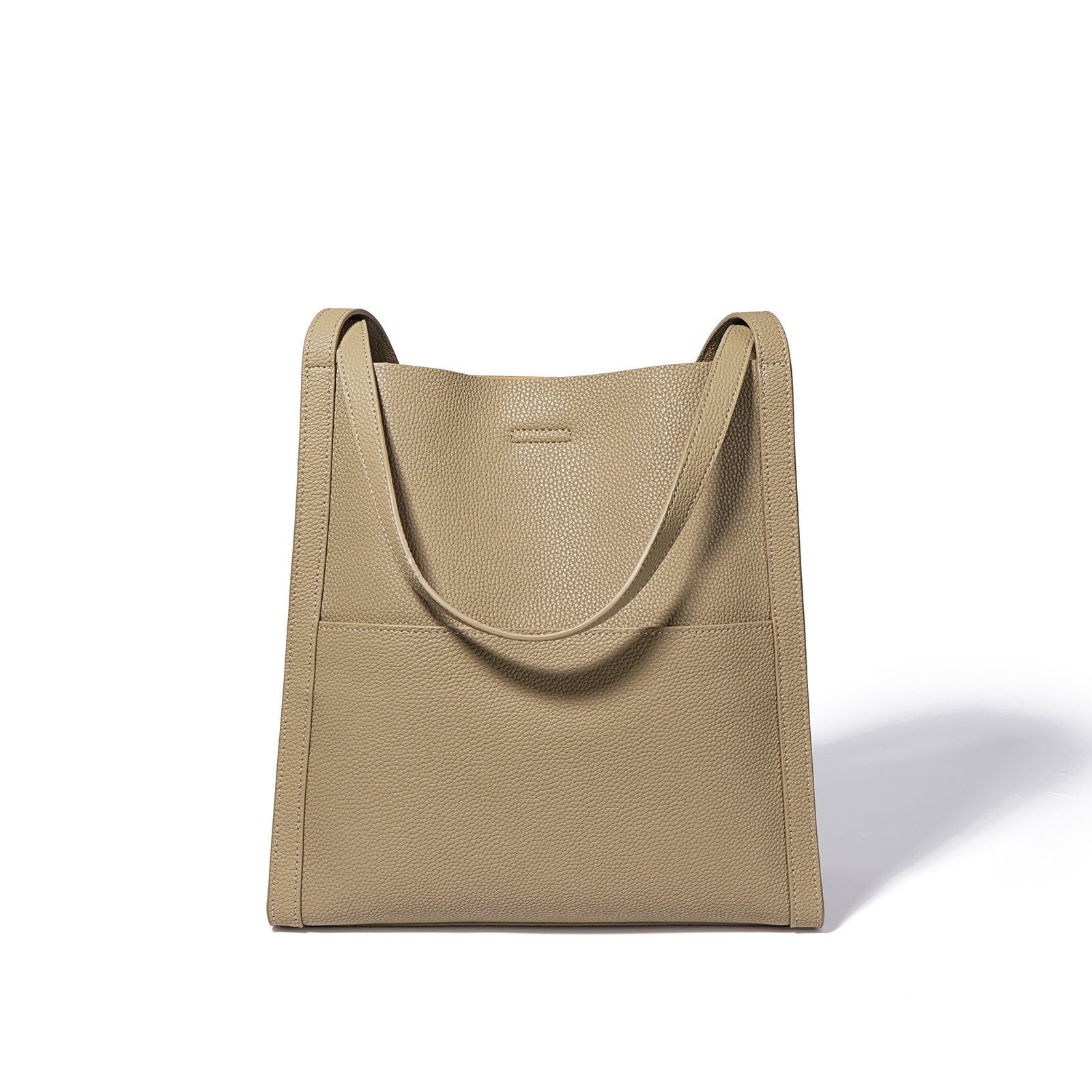 Beige handbag with a textured surface on a white background