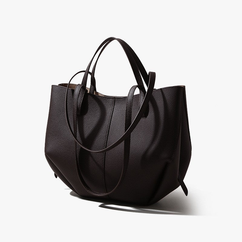 Black handbag on a white background
