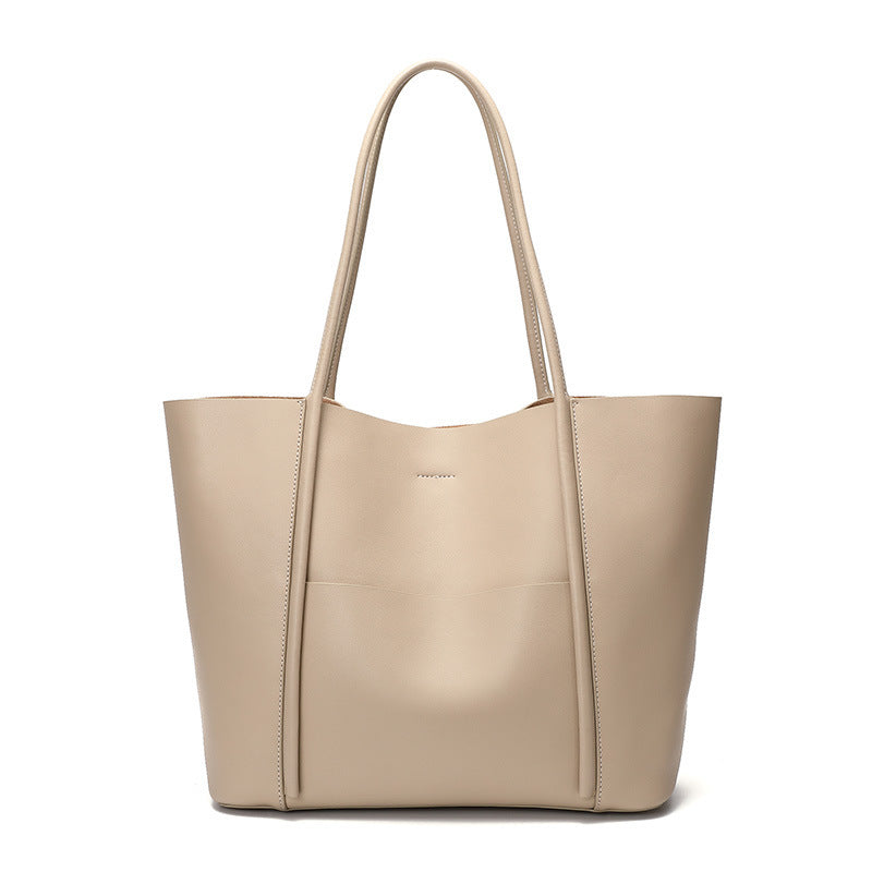 Beige handbag on a white background