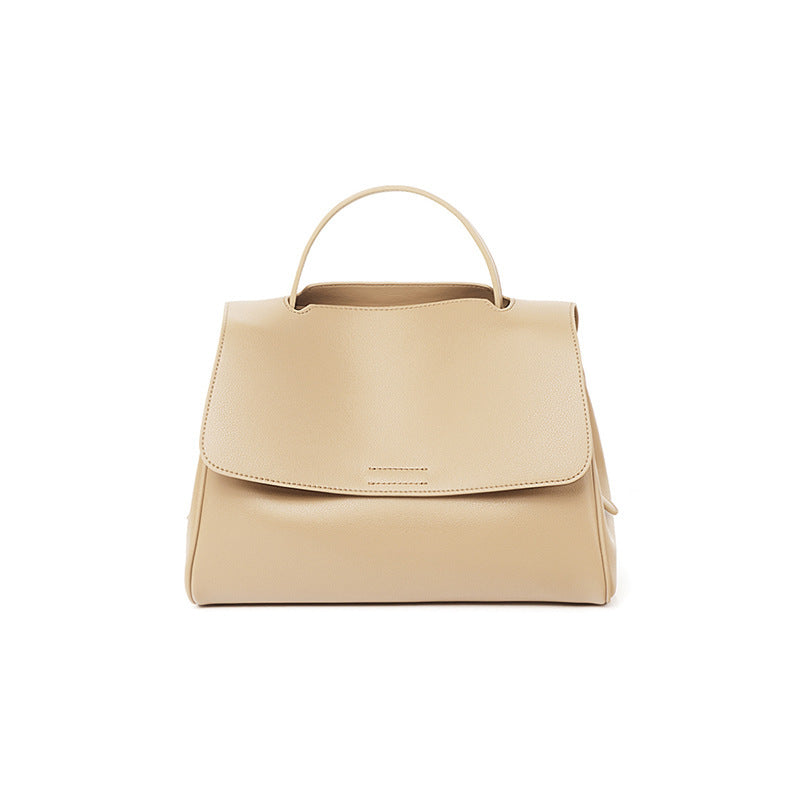 Beige handbag on a white background