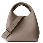 Beige handbag with a strap on a white background