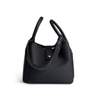 Black handbag on a white background