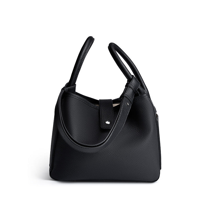 Black handbag on a white background