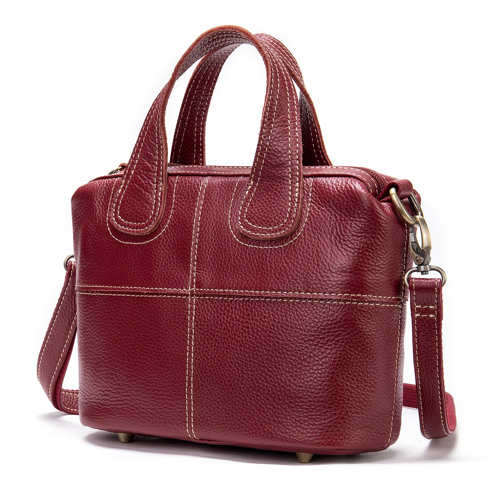 Red leather handbag with a shoulder strap on a white background