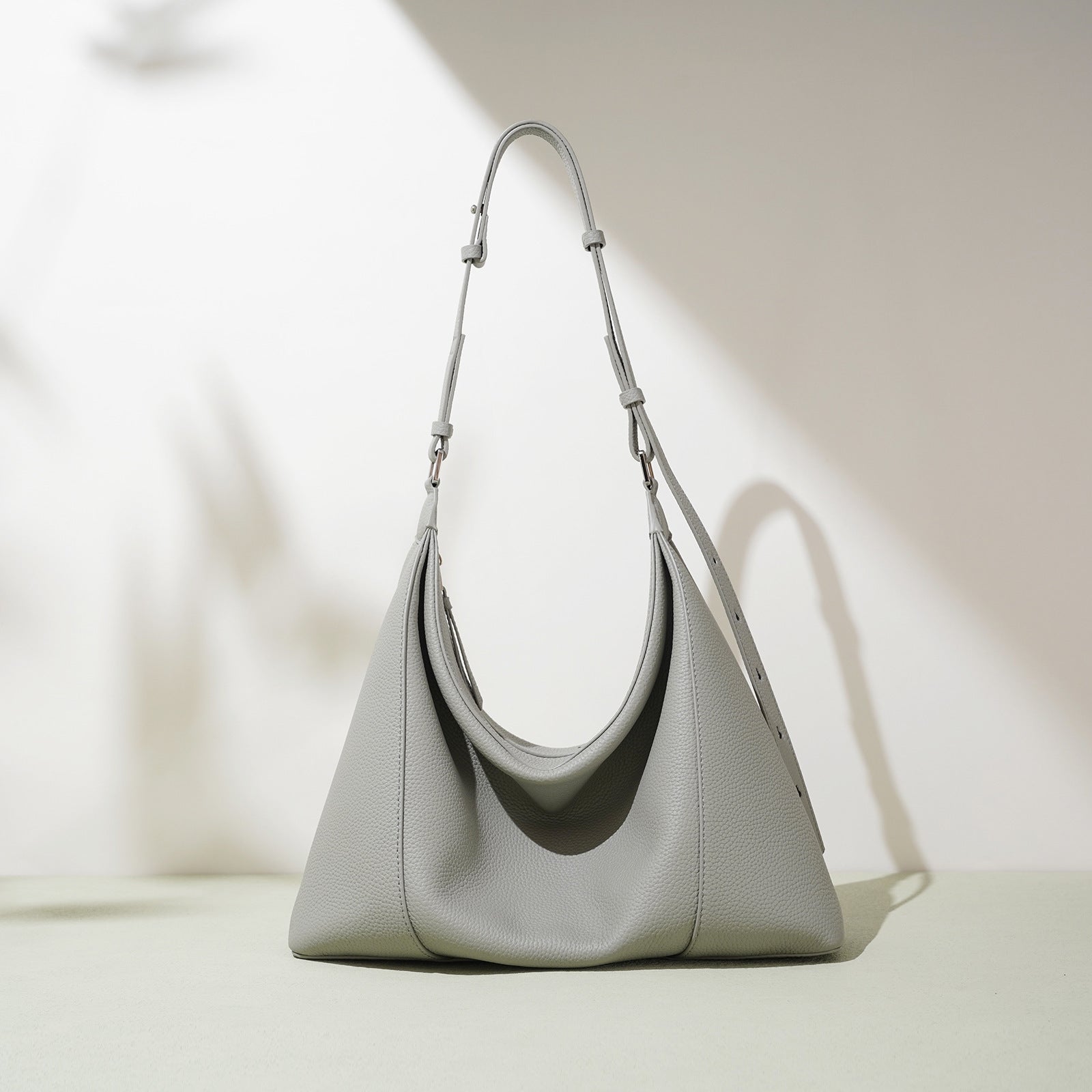 Light gray handbag on a light background