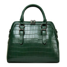 Green crocodile-patterned handbag on a white background