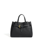 Black handbag with a gold buckle on a white background