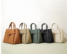 Set of handbags in various colors on a light background