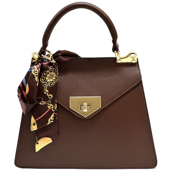 Brown handbag with gold accents and a matching scarf on a white background