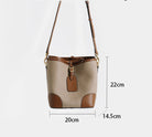 Beige and brown handbag with measurements on a white background