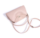 Beige handbag with a strap on a white background