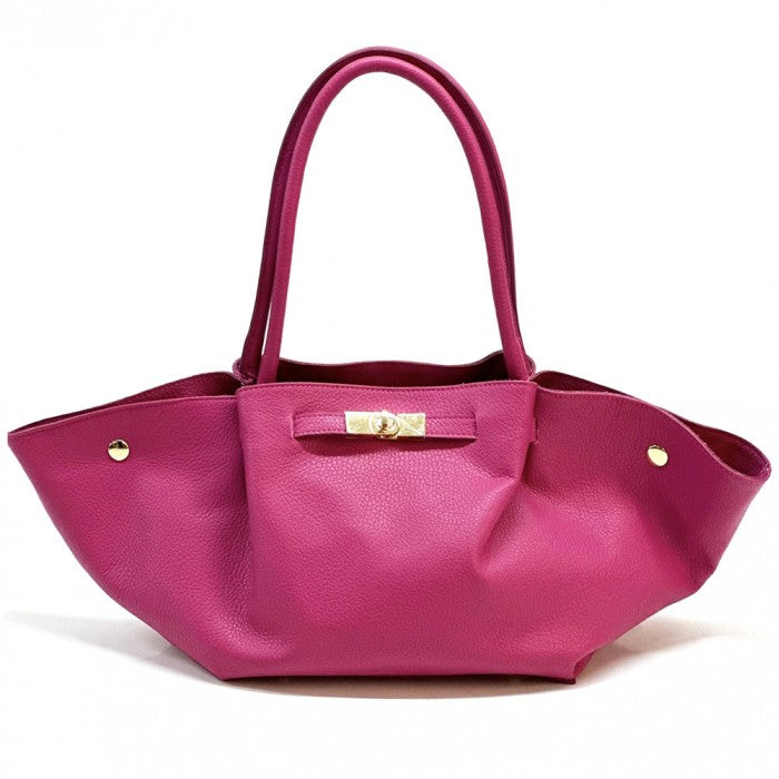 Pink handbag with gold accents on a white background