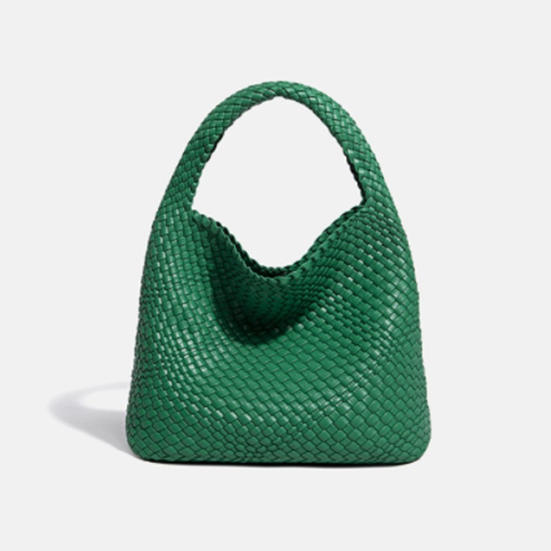 Green woven handbag on a white background