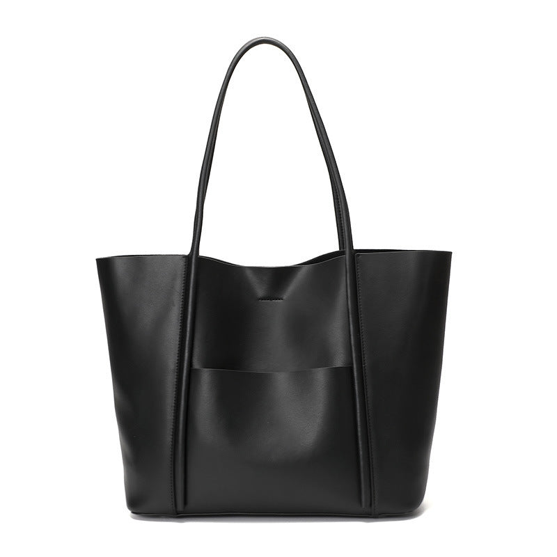 Black leather tote bag on a white background