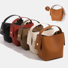 Set of leather handbags in various colors on a white background