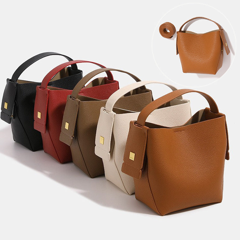 Set of leather handbags in various colors on a white background